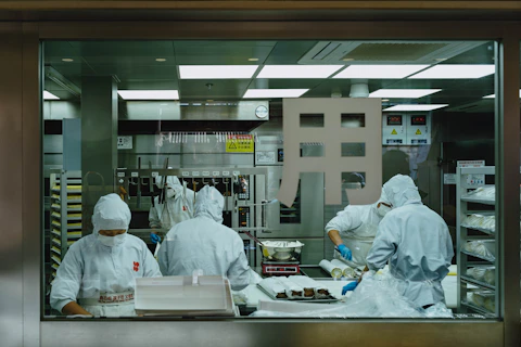 A group of people working in a kitchen