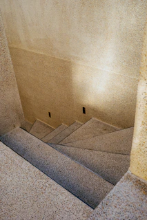 A set of stairs leading up to the top of a building