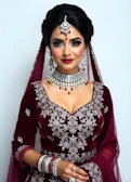 A woman wearing a red and white outfit and jewelry