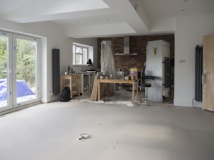 A room that has a lot of windows in it  and in renovation process