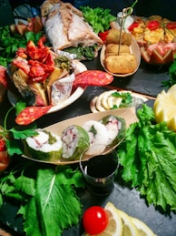 A table topped with lots of different types of food