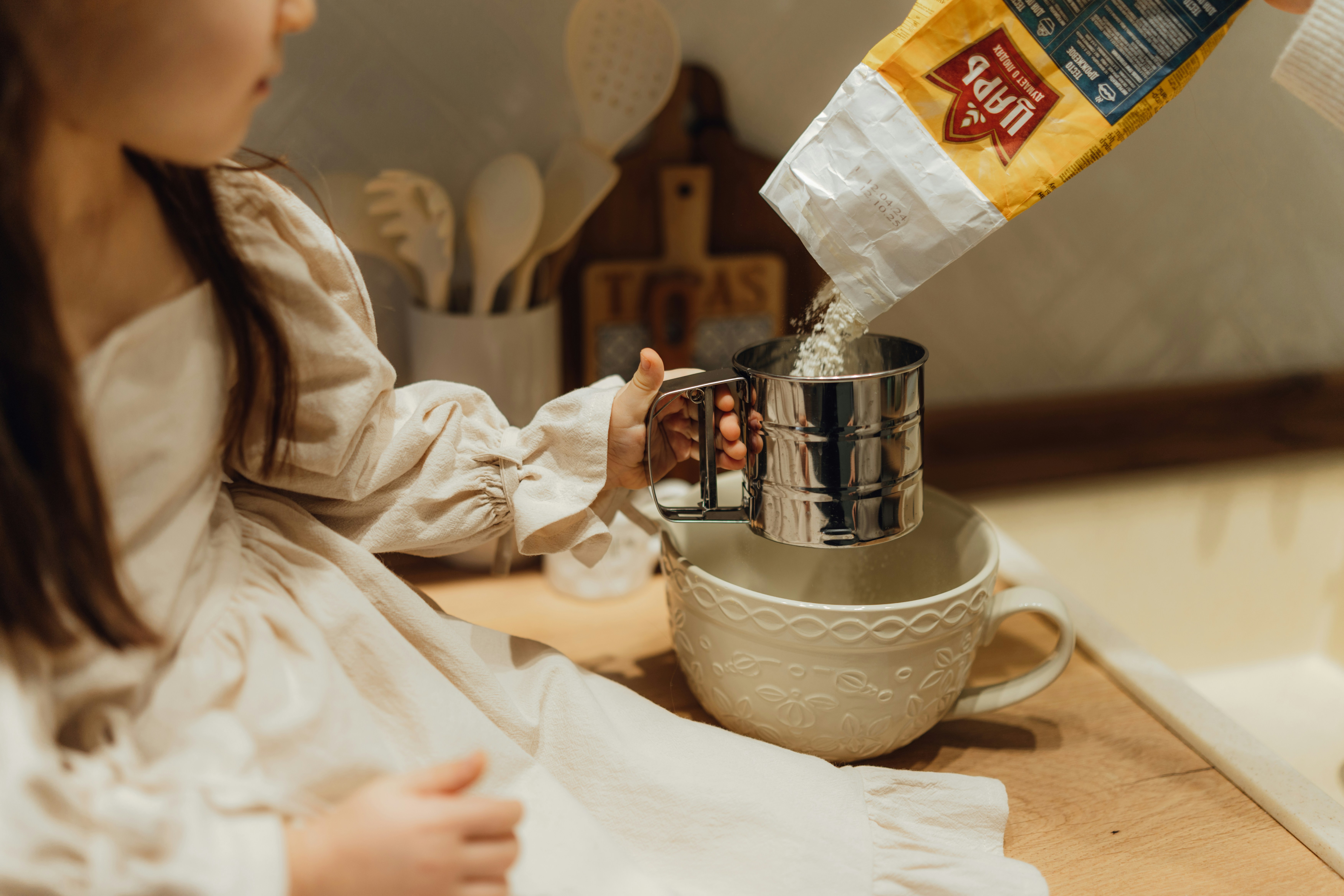 A child learning to prepare a simple snack in a kitchen setting - aba therapy after school