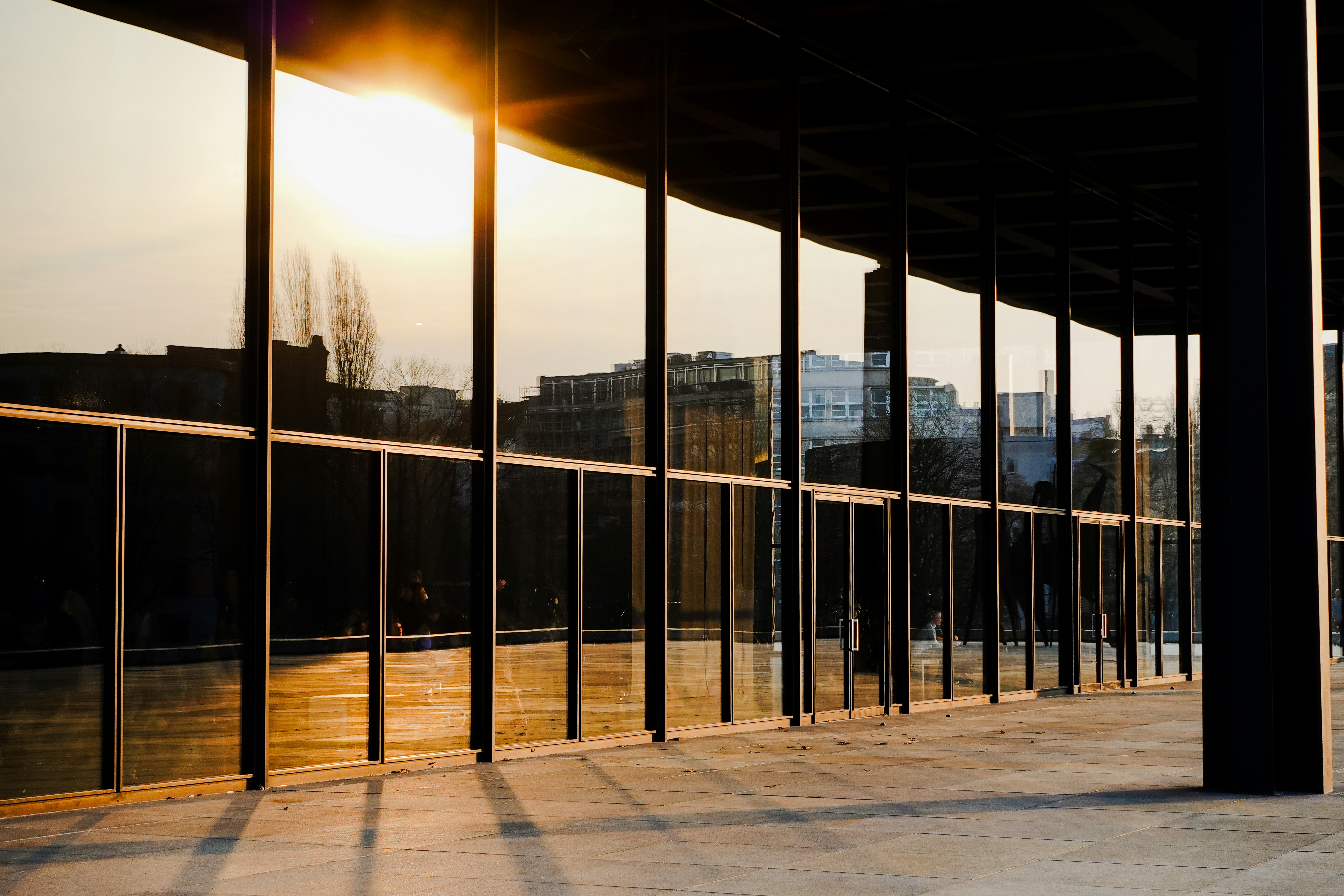 The sun is shining through the windows of a building