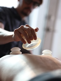 A man getting a back massage at a spa