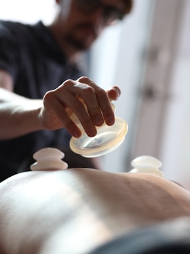 A man getting a back massage at a spa