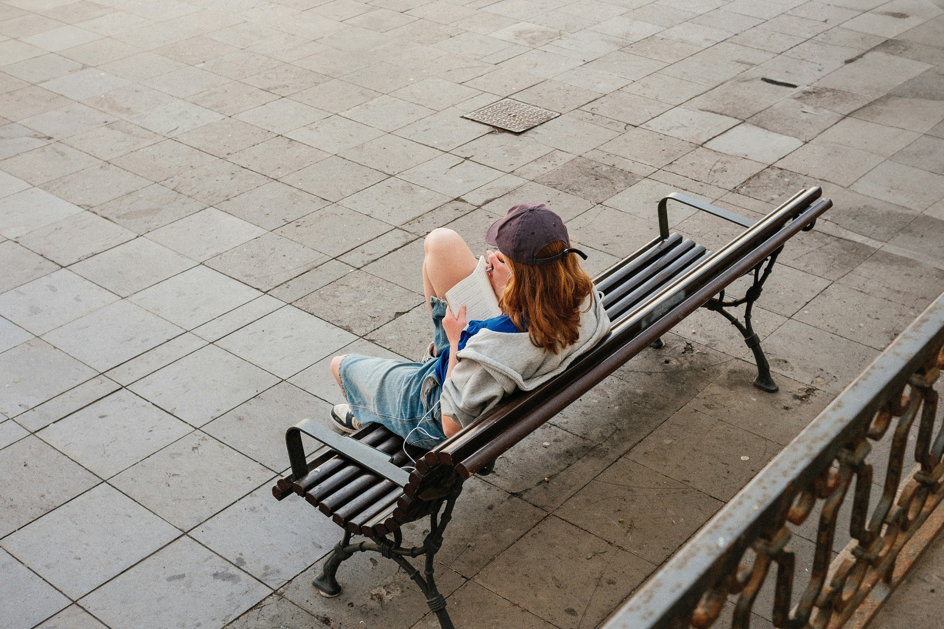 A man and woman sitting on a park bench