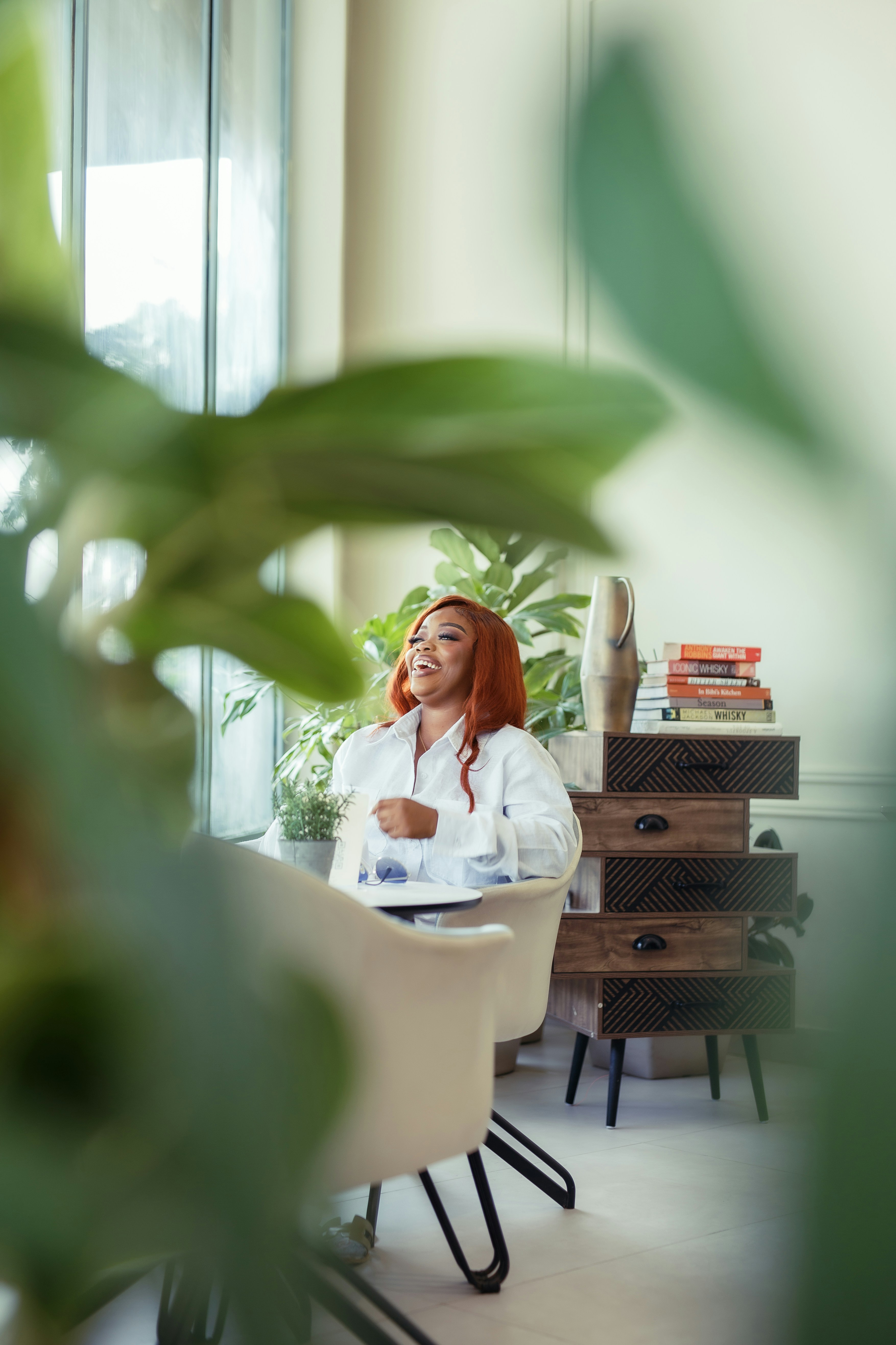 A woman sitting at a table in a room