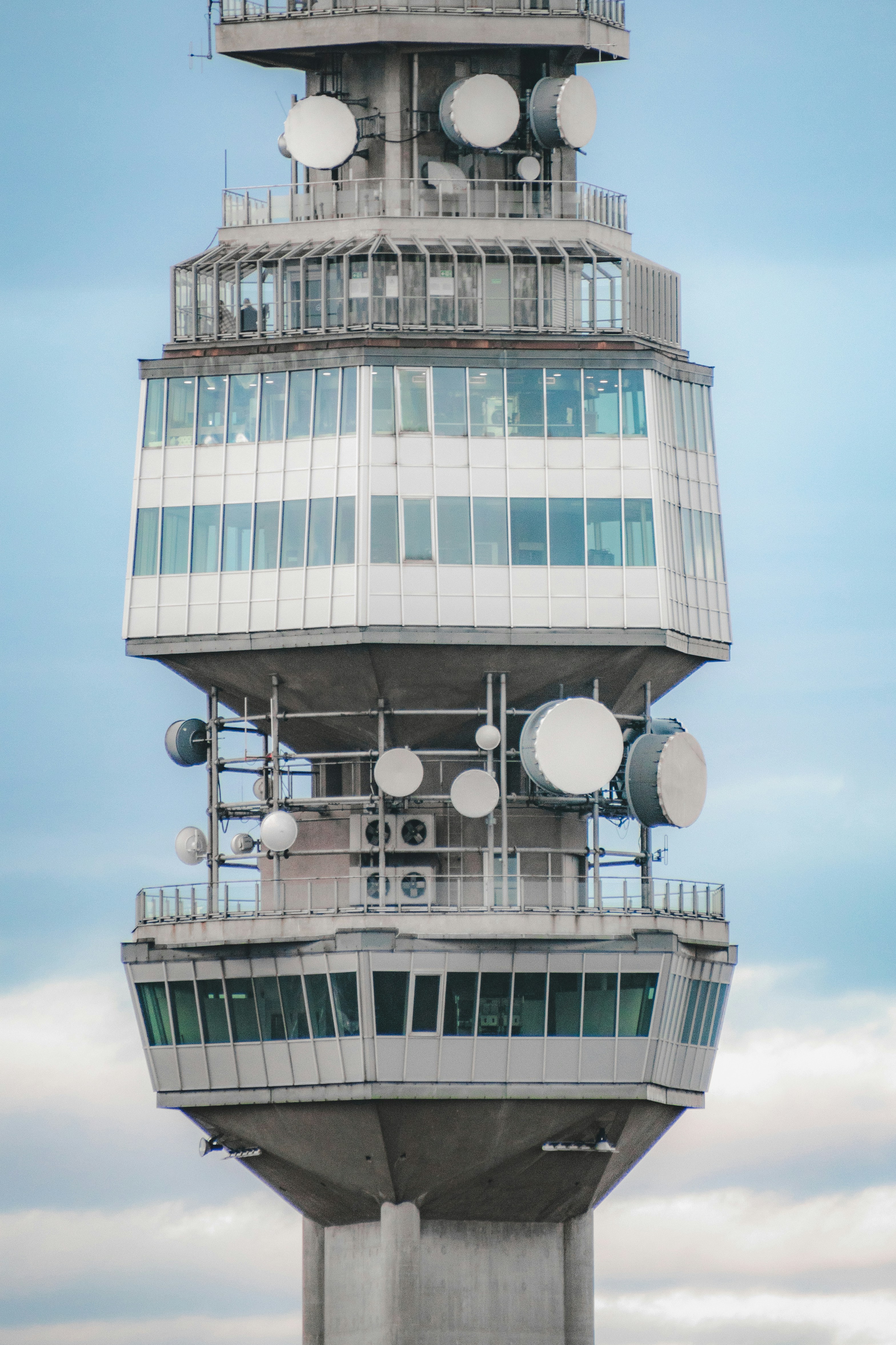 A tall tower with a clock on the top of it