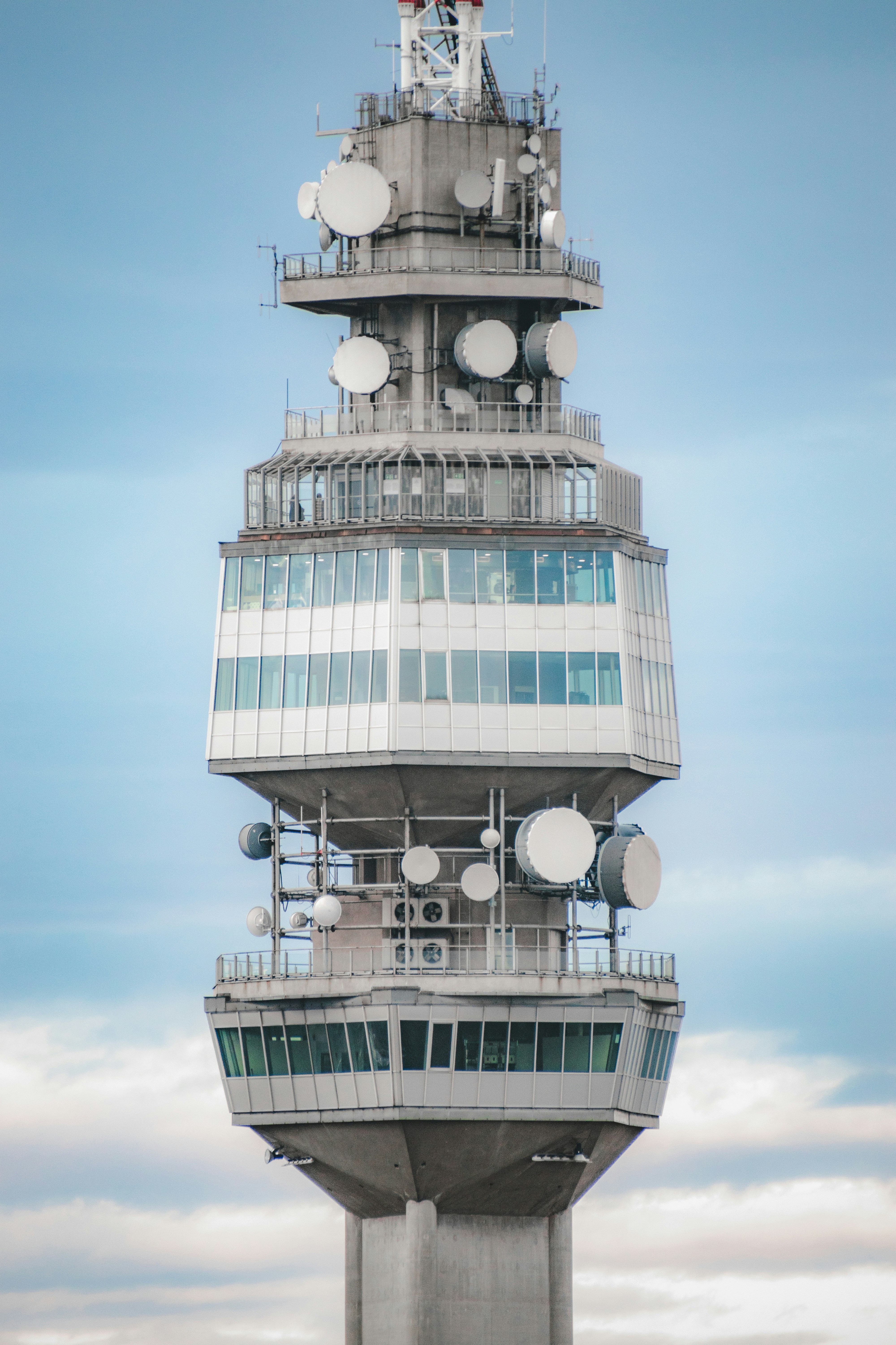 A tall tower with a clock on the top of it