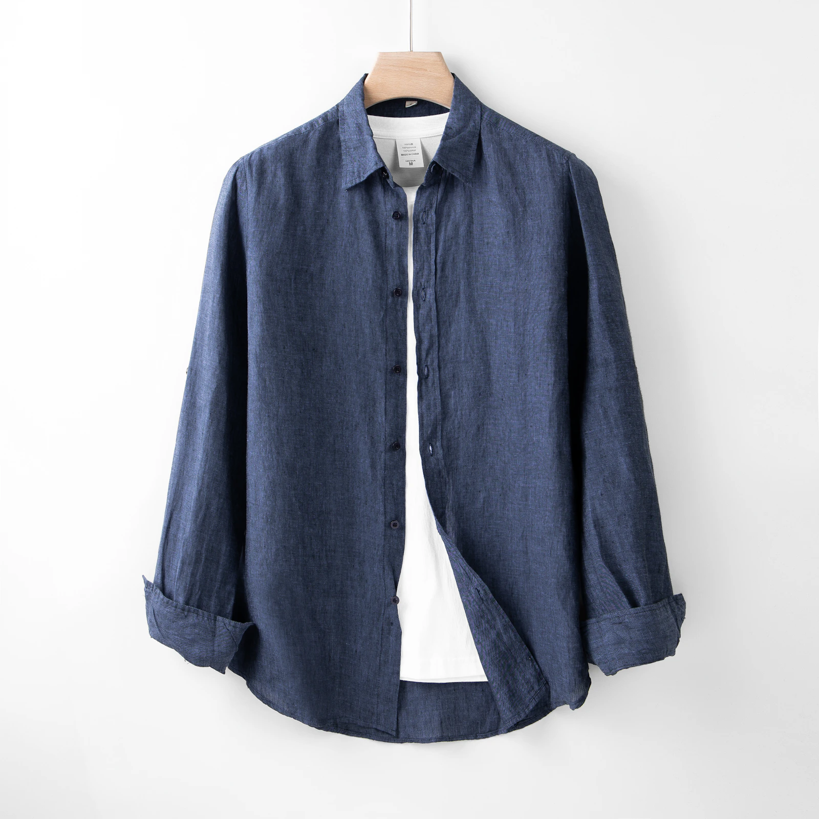 Navy linen shirt on hanger