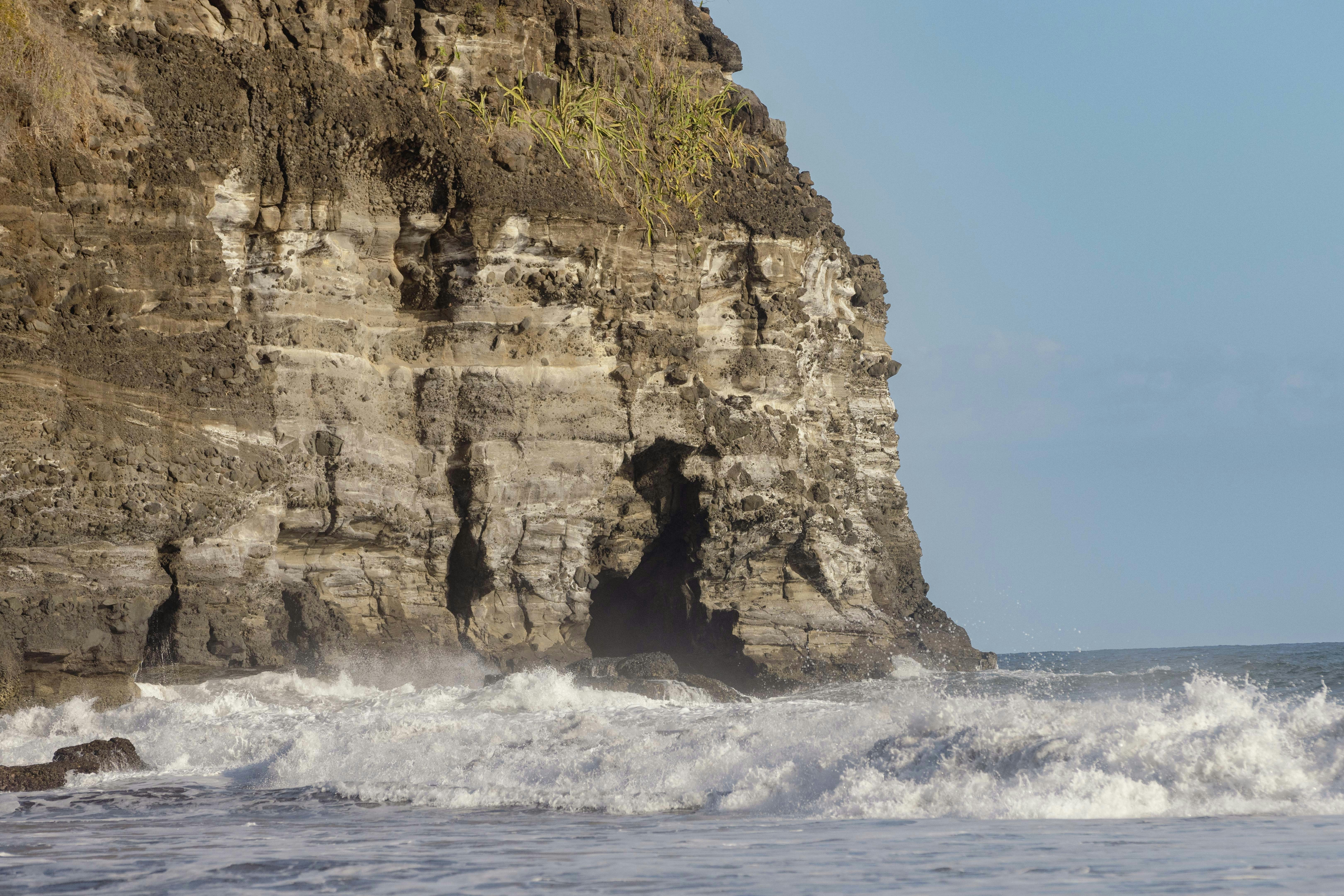 A man riding a surfboard on top of a wave in the ocean