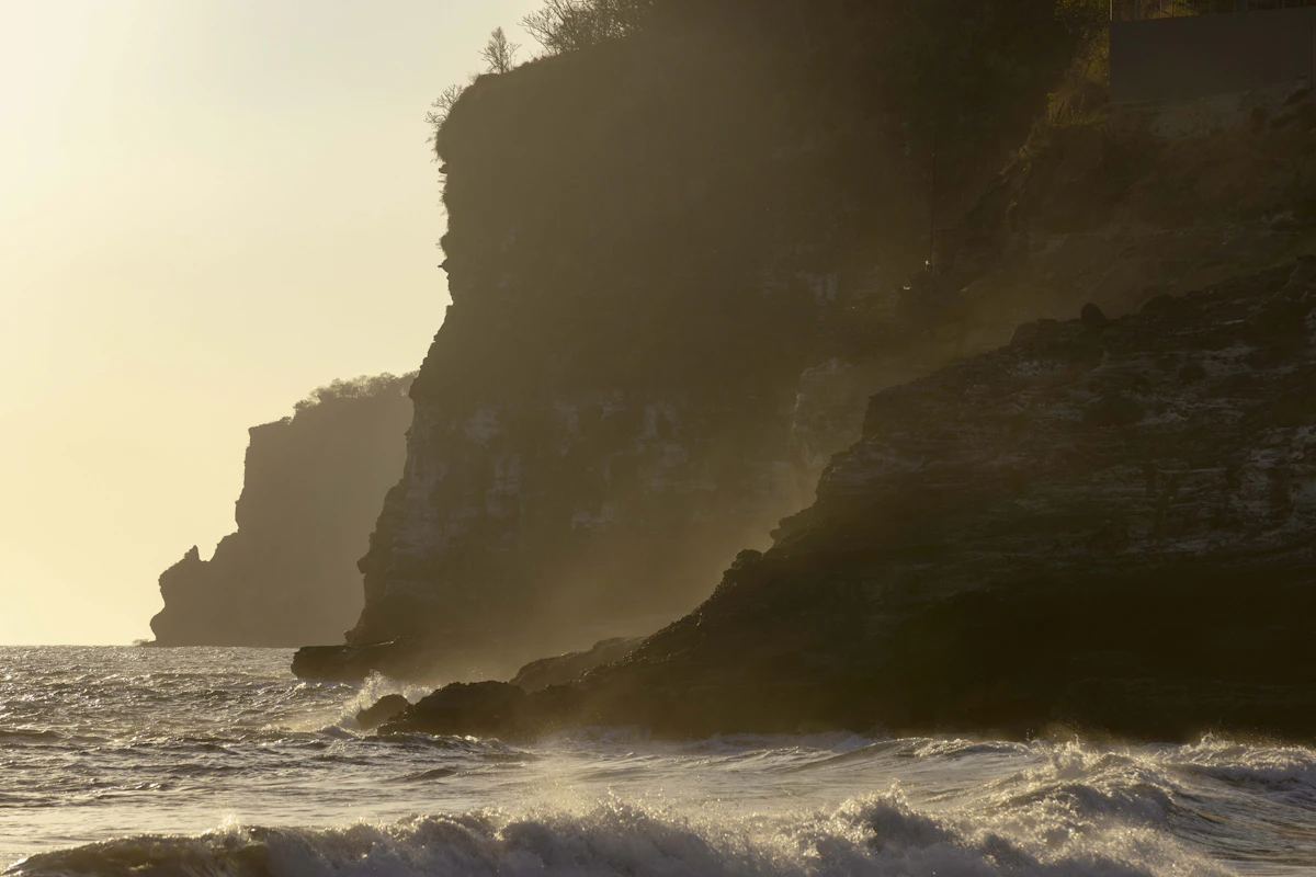 A surfer carving down a wave