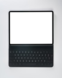 A black laptop computer with a white screen