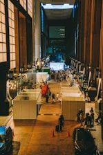 A group of people standing in a large building