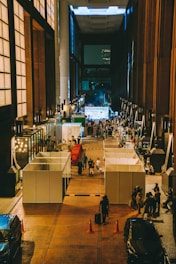 A group of people standing in a large building