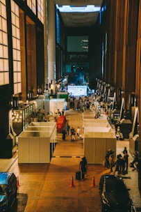 A group of people standing in a large building
