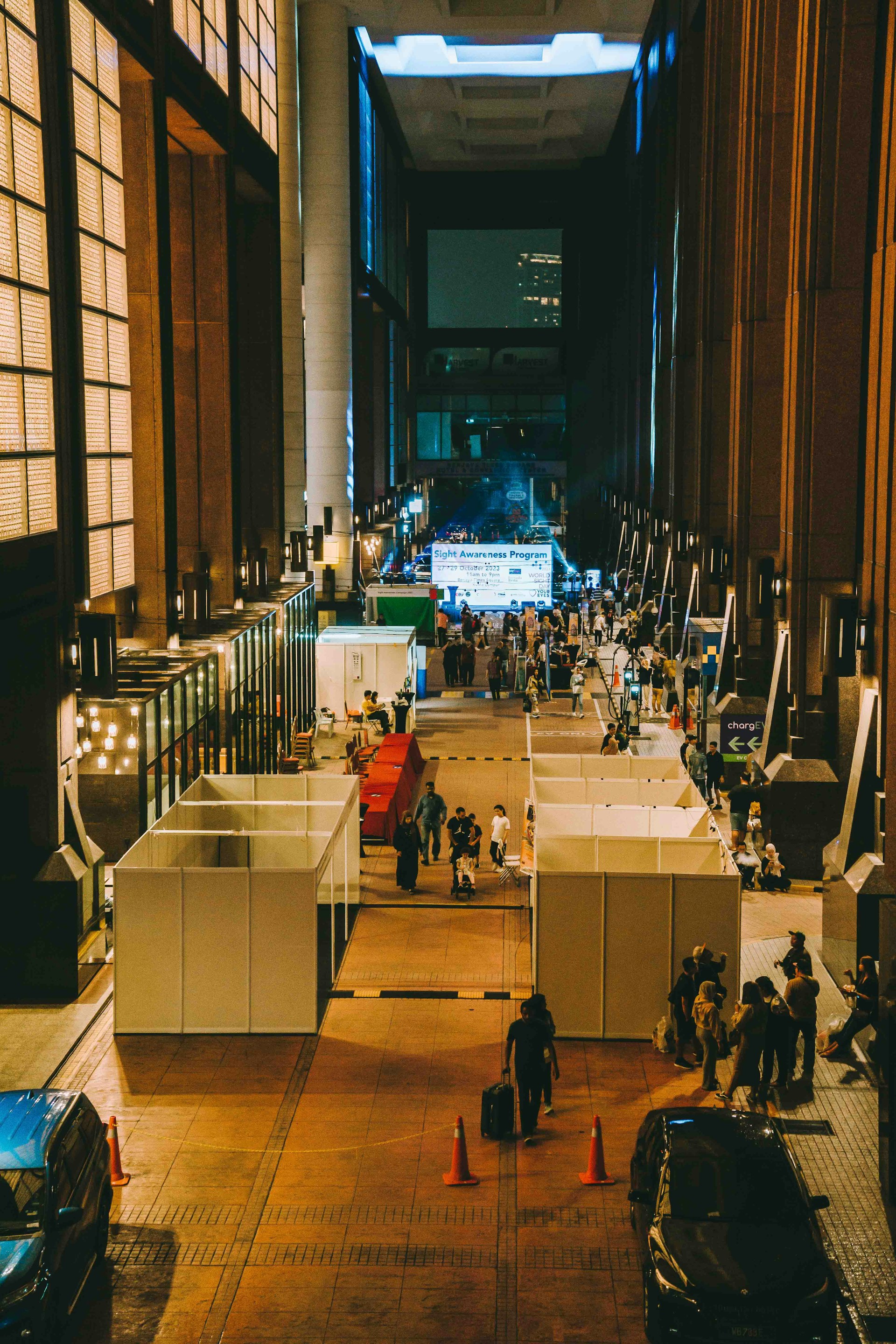 A group of people standing in a large building