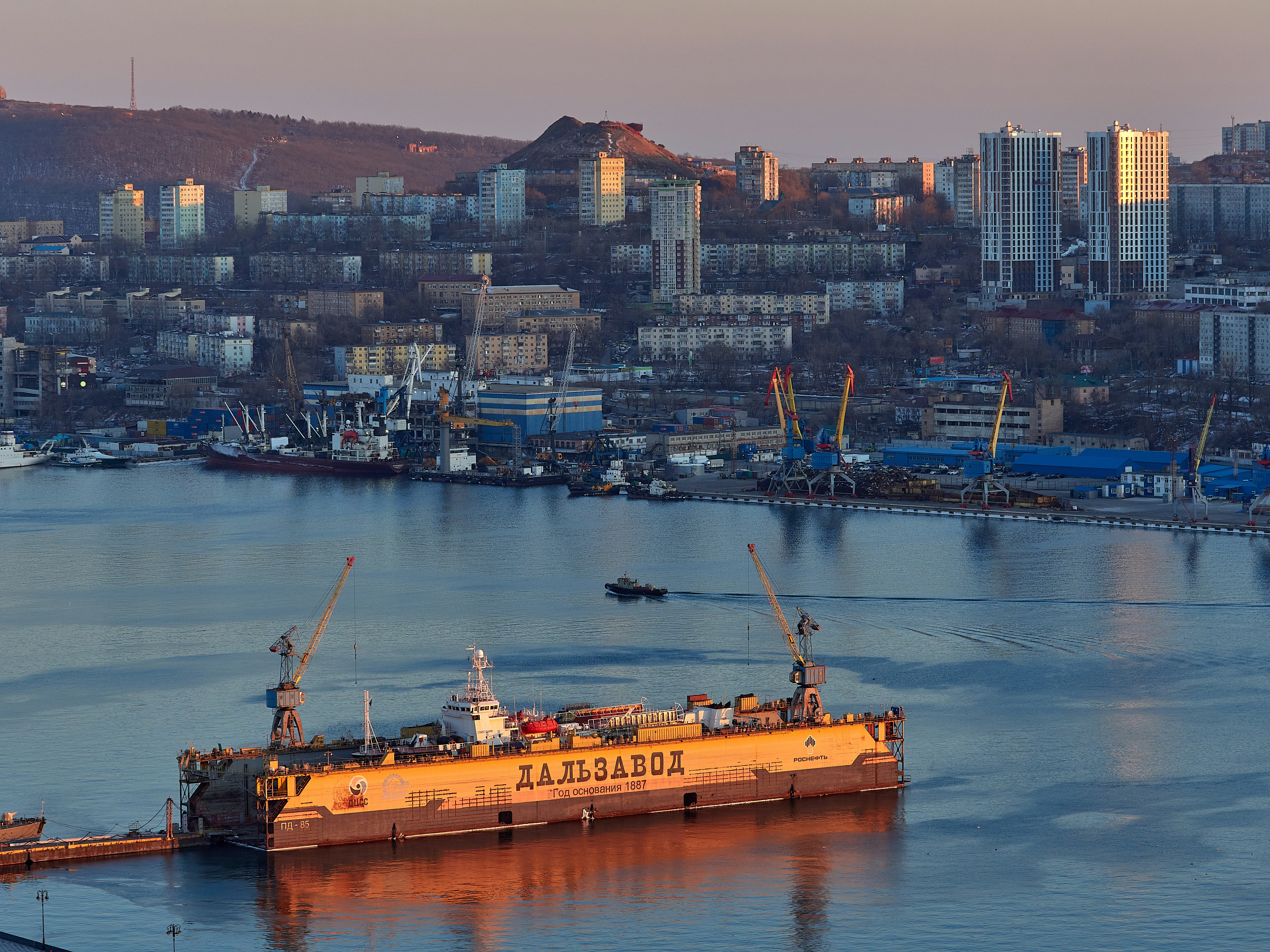 A large boat floating on top of a body of water