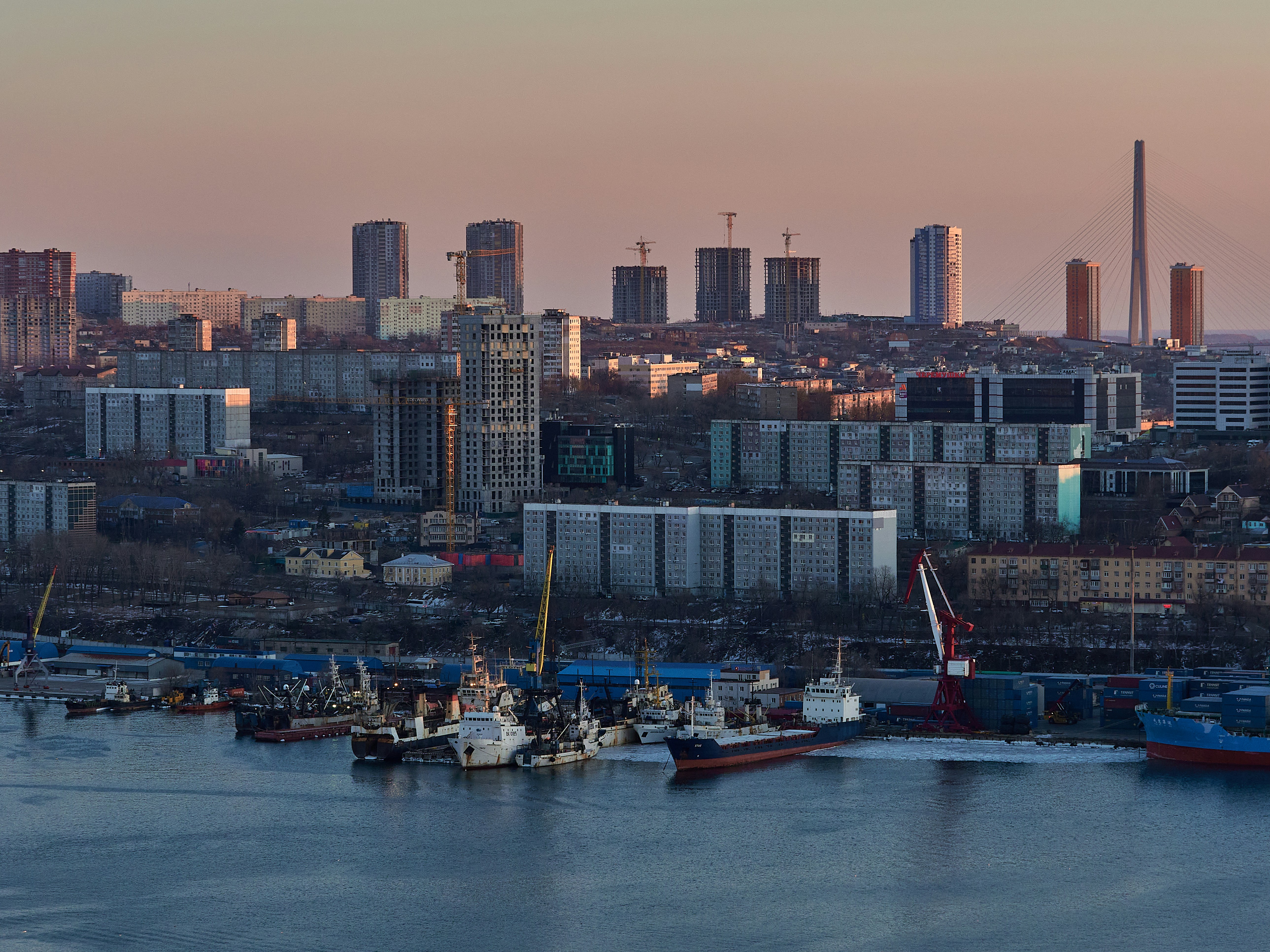 A large body of water with a city in the background