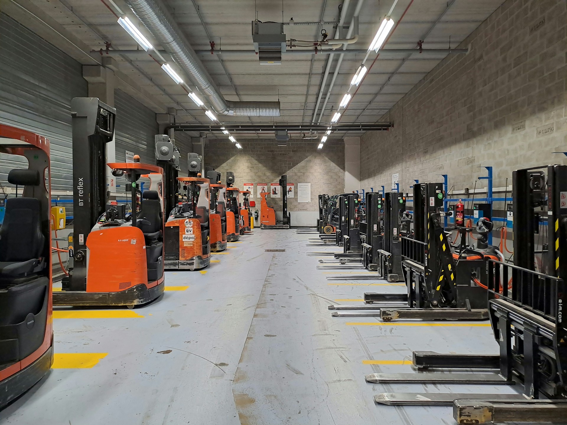 A large warehouse filled with lots of machines