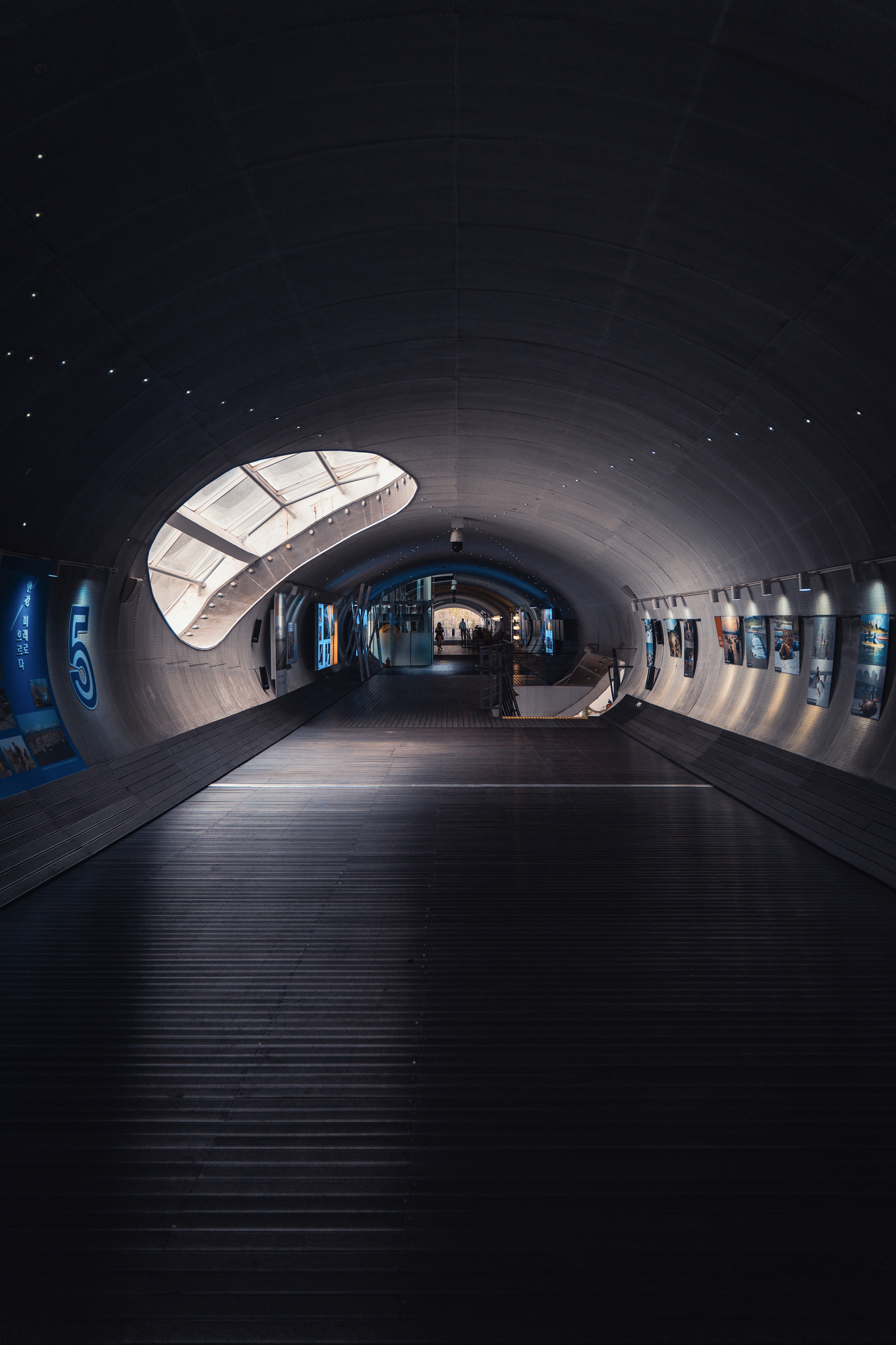 A tunnel with a train on the inside of it