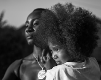 A woman holding a child in her arms