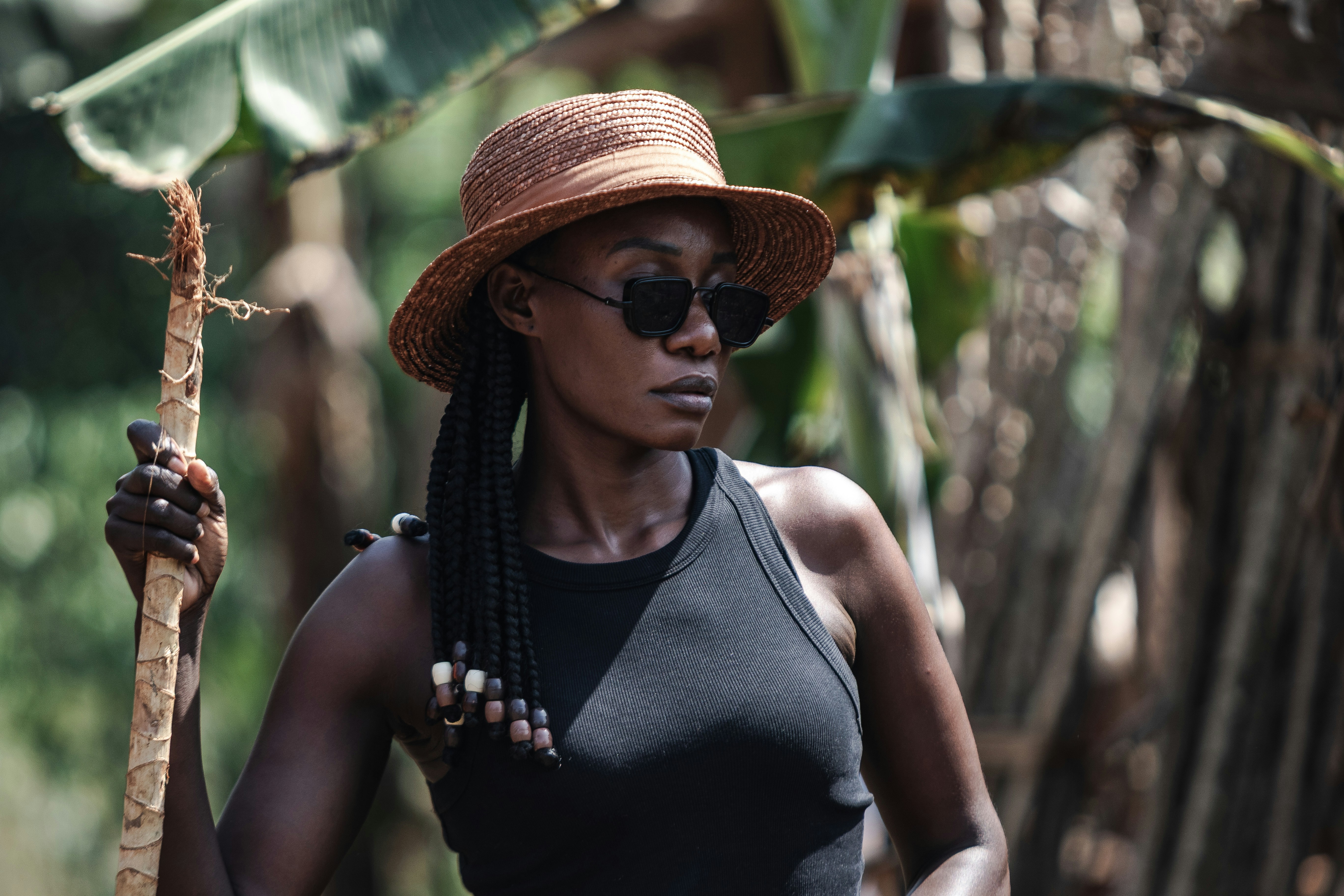 African farm girl in sunglasses and a hat