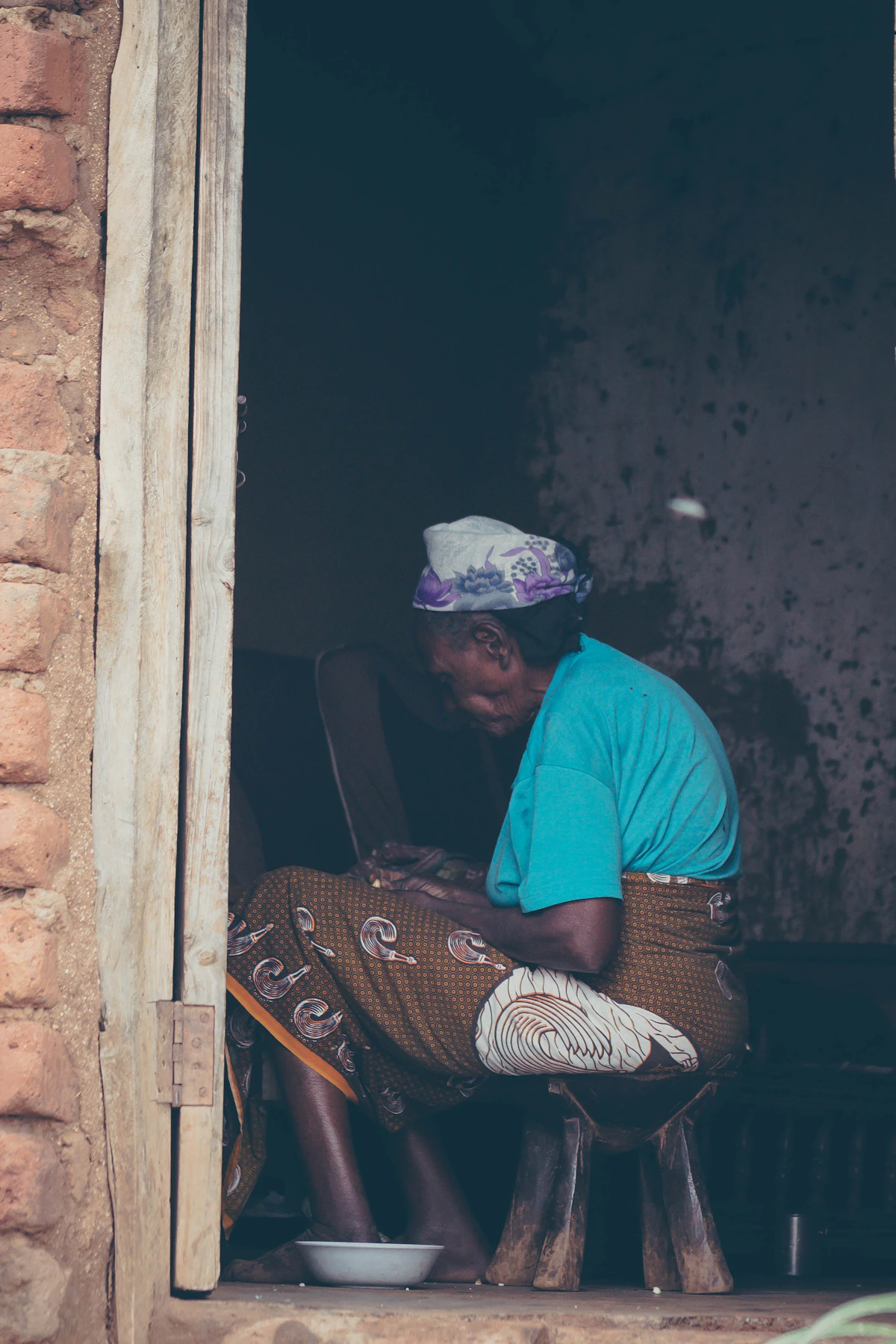 Black developer comparing AI software tools at a modern workstation in Nairobi