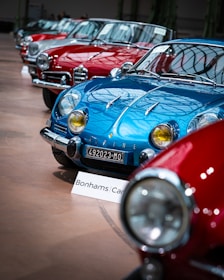A row of classic cars parked next to each other