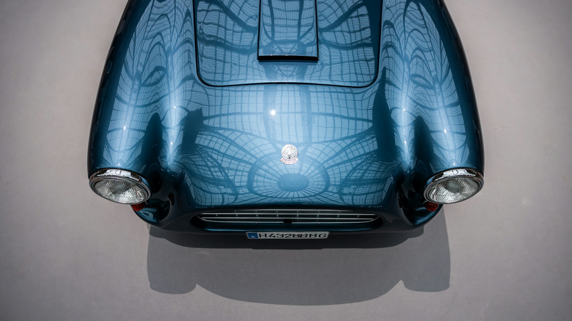 The back of a car with a blue design on it