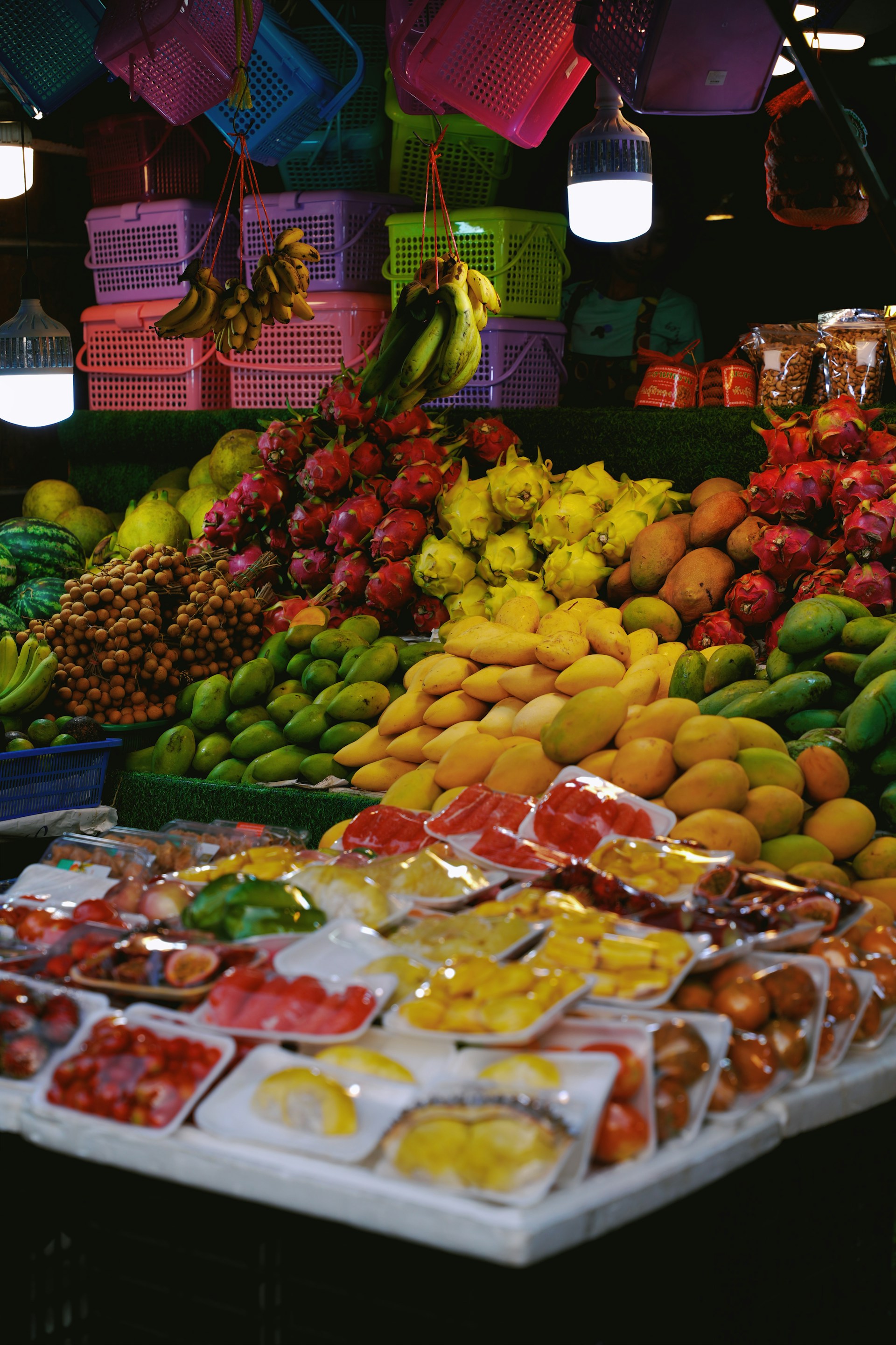 A fruit stand with a variety of fruits and vegetables