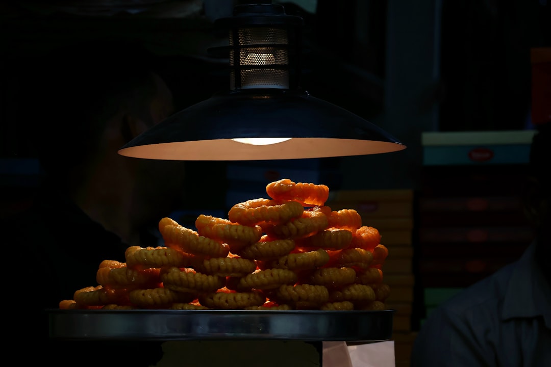 A man sitting at a table with a plate of food in front of him,