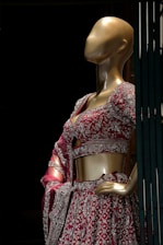A mannequin dressed in a red and white dress