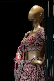 A mannequin dressed in a red and white dress
