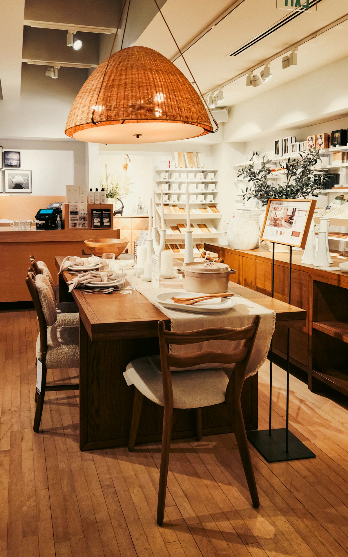 Dining room with wooden table, dining chairs and pendant lighting