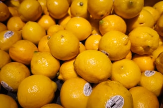 A pile of lemons sitting on top of each other