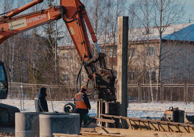 A construction site with an excavator at work.