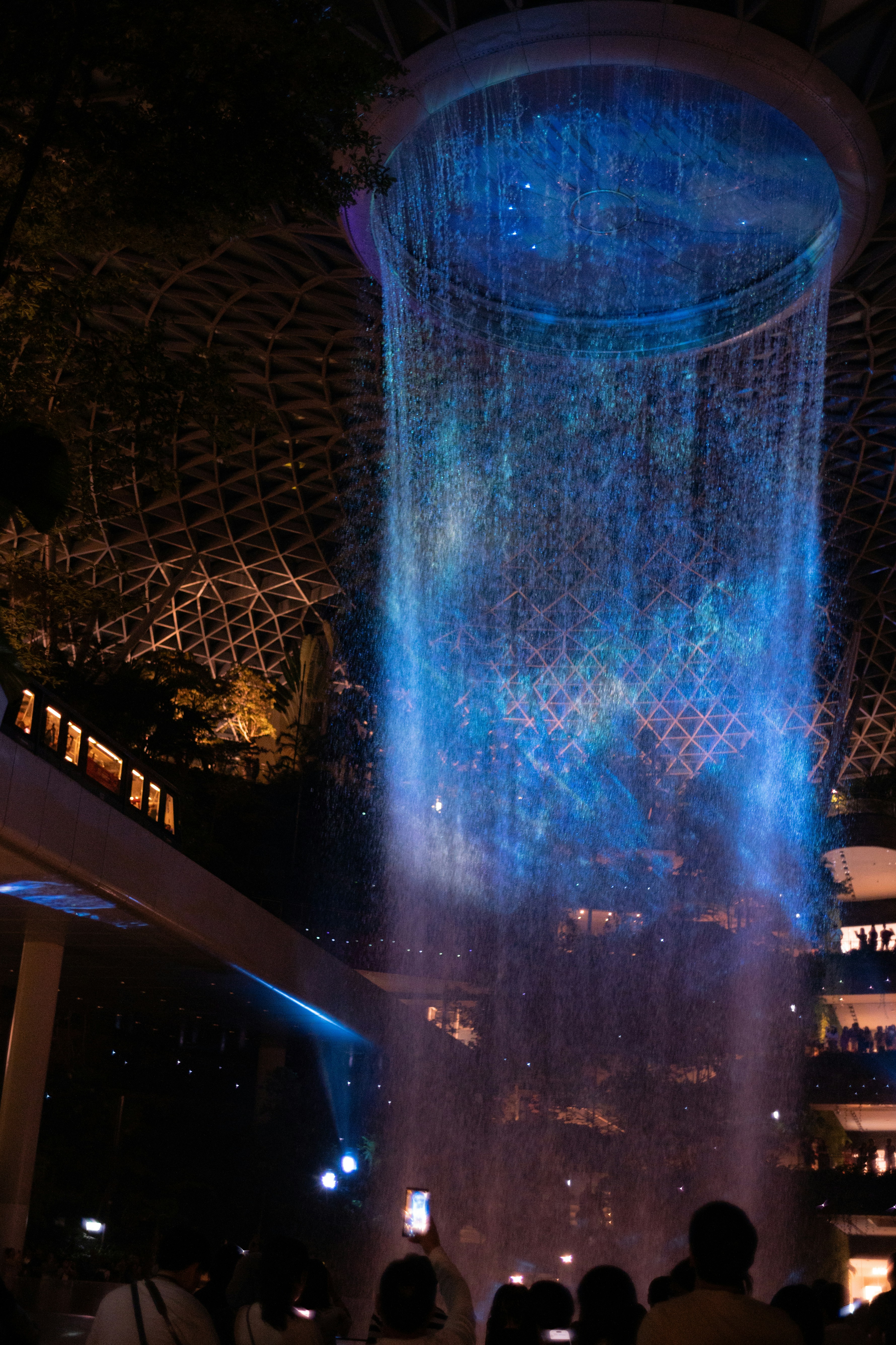 The Rain Vortex inside Jewel Changi Airport at night