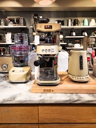 A counter top with a blender and other appliances on it