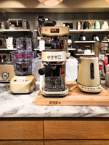 A counter top with a blender and other appliances on it