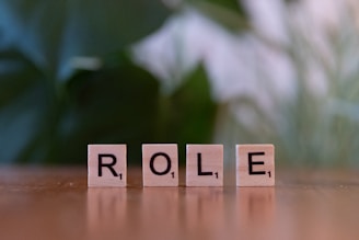 The word role spelled with scrabble blocks on a table