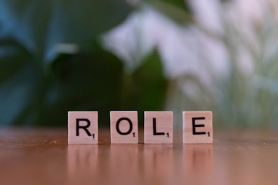 The word role spelled with scrabble blocks on a table