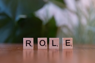 The word role spelled with scrabble blocks on a table