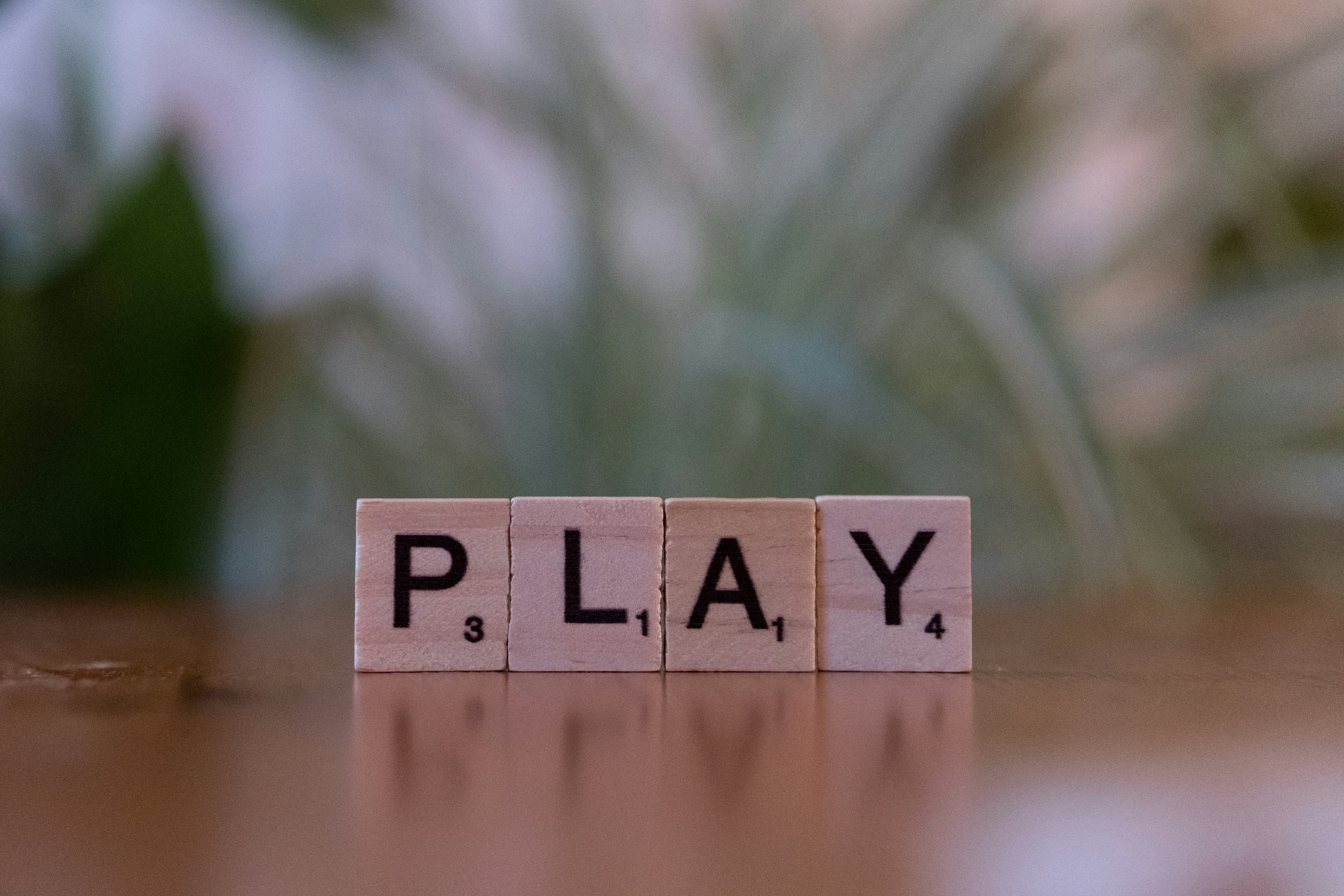 A wooden block spelling play on a table