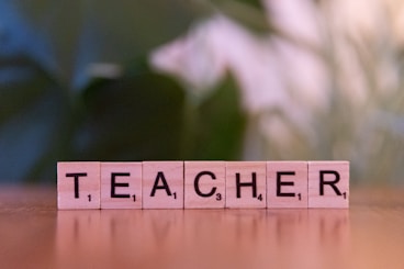 A wooden block spelling out the word teacher