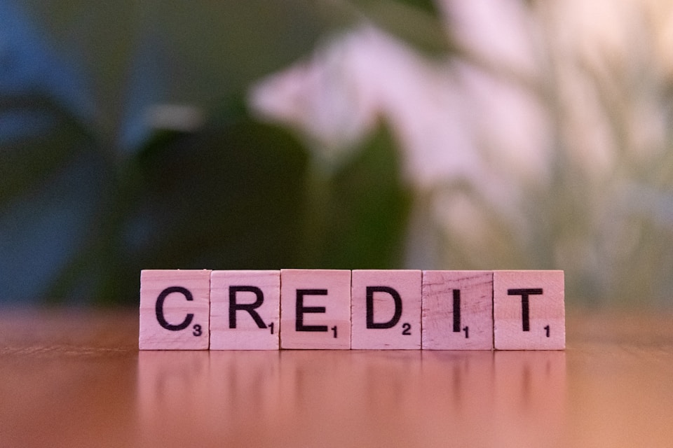 The word credit lined up letter by letter on small blocks
