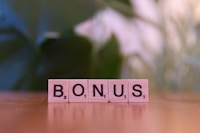 A close up of a scrabble type word on a table