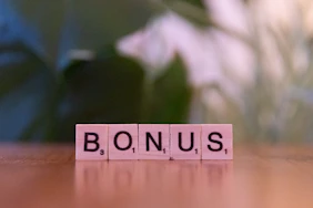 A close up of a scrabble type word on a table