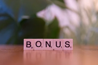 A close up of a scrabble type word on a table