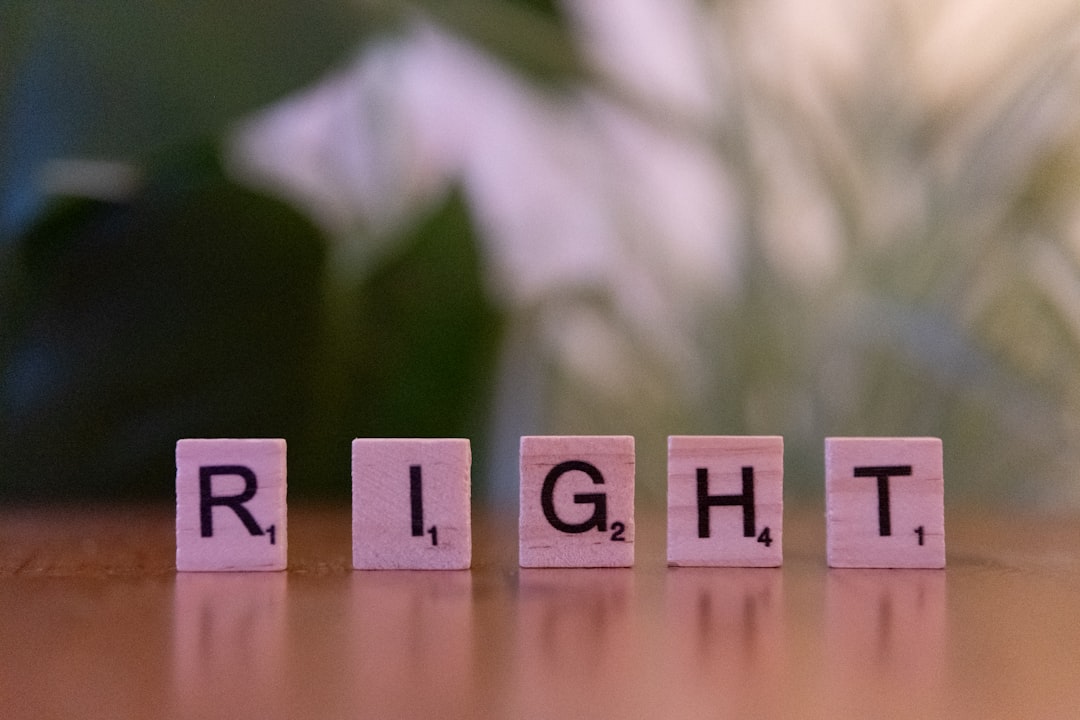 The word right spelled with scrabble blocks on a table,